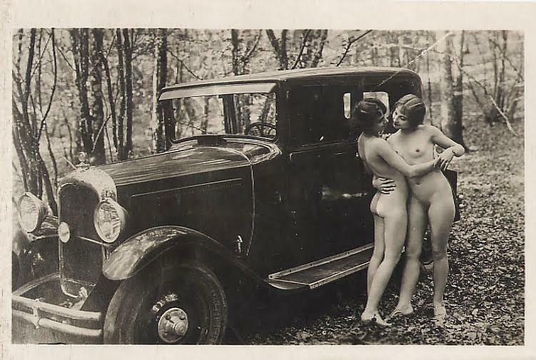 1920s lesbian motorists take a break in the forest.