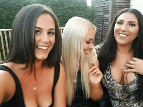 Blondie checking out her friend's big tits