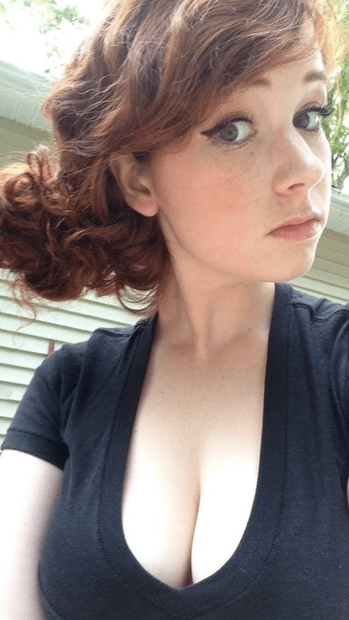 Cute busty redhead