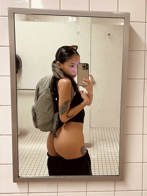 what do you call a woman who sneaks out to the bathroom in the middle of class just to take booty pics?