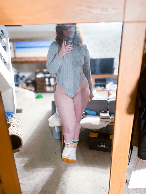 Thick British redhead that adores a body suit