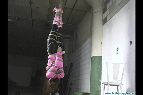 Lovely lady hung upside down in a Warehouse.