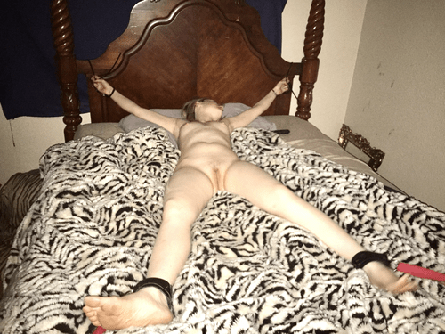 Good ol spread eagle bedroom bondage. She isn’t going anywhere....