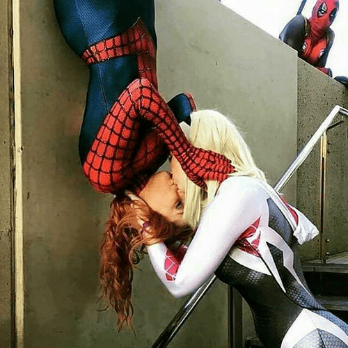 Gwen Stacy and Mary Jane sharing a kiss.